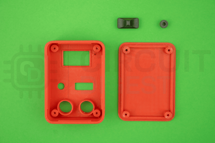 3D printed enclosure components including front panel, back cover, and button caps for digital micro amp meter assembly