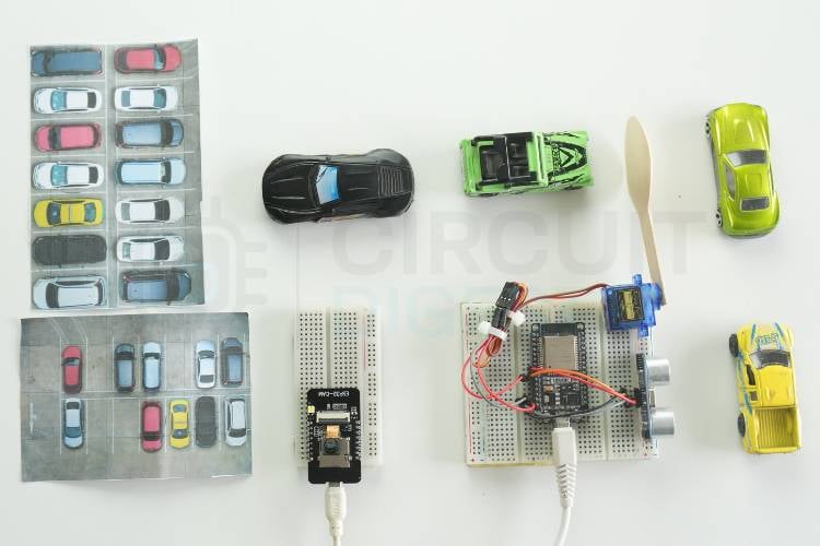 Assembled ESP32-CAM automatic parking space detection system hardware on breadboard with push button wired to GPIO 13