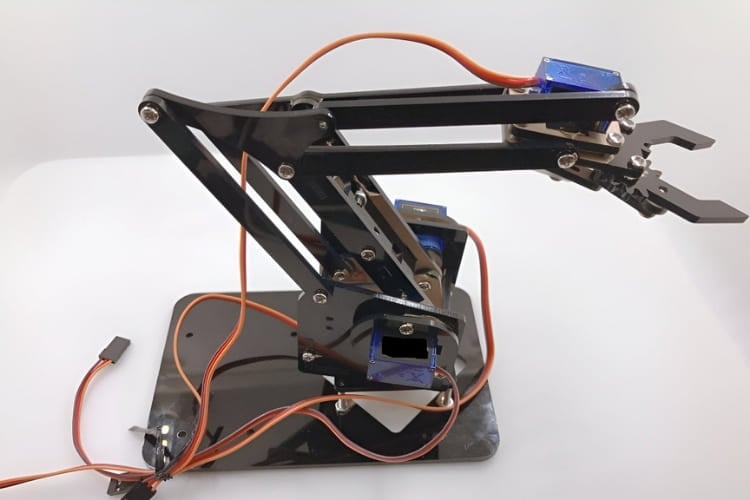 A 4-DOF robotic arm controlled wirelessly through an ESP32-based smartphone or web interface.