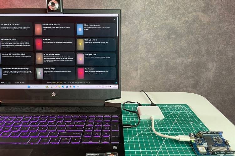 Hardware setup showing Arduino UNO Q connected to a USB hub, webcam, and laptop for face detection
