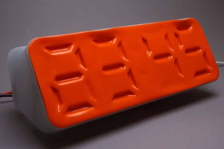 Microfluidic Air Clock with Soft Robotics Design