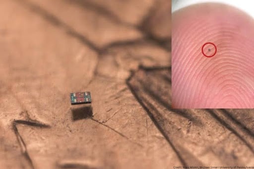 The M3 (Michigan Micro Mote) computer shown on a fingertip for scale