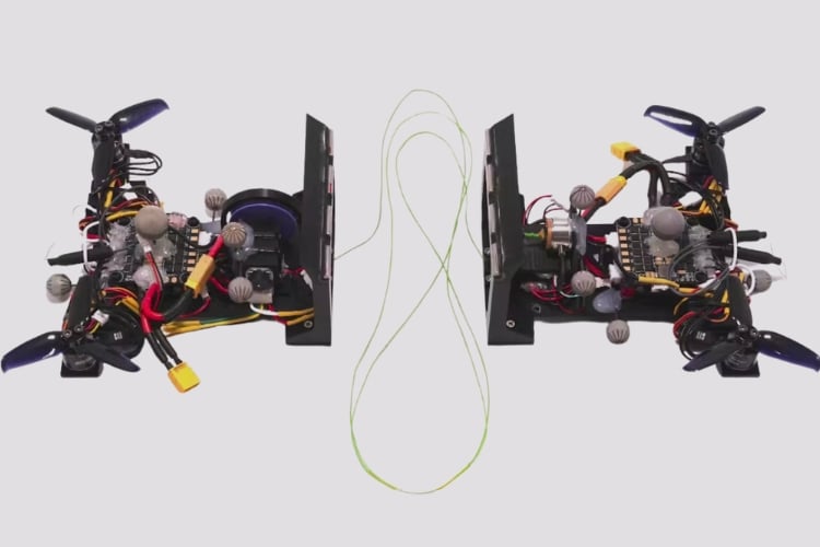 Two Bicopters Connected By Cable Form Quadcopter