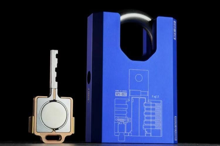 A close-up of a futuristic mechanical padlock designed by Shane Wighton