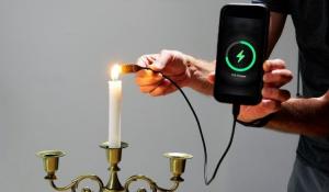Candle Flame Heats Thermoelectric Generator Charging Smartphone