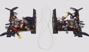 Two Bicopters Connected By Cable Form Quadcopter